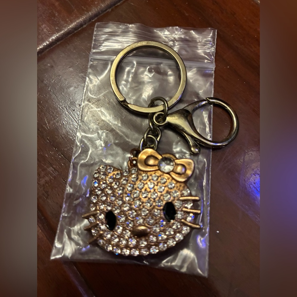 Adorable Crystal/diamond like Hello Kitty Keychain with Gold Accents!
